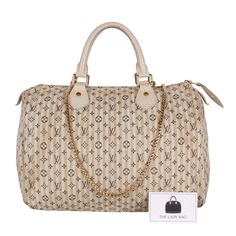 Authentic, pre-owned Louis Vuitton mini lin Speedy 30 with removable strap. This Speedy tote features monogram mini lin canvas which is 58% cotton, 24% linen, and 18% polyamide. This canvas is soft, lightweight, and very resistant. There are beige cowhide rolled leather handles and brass handle links. The top brass zipper opens to an interior of fabric with pockets. This is a marvelous tote that is ideal for everyday wear, from Louis Vuitton! The strap can be used on many of the Louis Vuitton ba Louis Vuitton Pumps, Louis Vuitton Pallas, Louis Vuitton Speedy 35, Leather Formal Shoes, Pre Owned Louis Vuitton, Brown Leather Backpack, Louis Vuitton Speedy 30, Brass Handle, Speedy 30