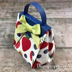 an origami bag with a bow on it