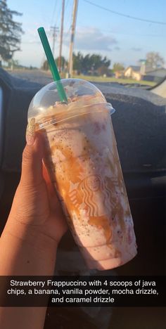 someone holding up a drink in their hand with the caption strawberry freppuccino with 4 scoops of lava chips, a banana, vanilla powder, mocha