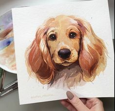 a painting of a dog is being held up