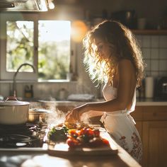 a woman is cooking in the kitchen with steam coming out of her pan and vegetables on the counter