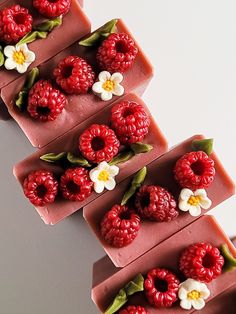 raspberry soap bars with flowers and leaves on them