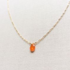 "This Carnelian necklace is made of genuine high quality faceted Carnelian. There are gold filled ,sterling silver and 14kt gold chain you can choose from. There are 2 sizes that you can choose from 16\" or 18\" in gold filled, sterling silver or 14k gold. This tiny carnelian necklace is light weight and elegant. The Carnelian jewelry stone is around 1.5 carats. This tiny carnelian necklace is great for layering with other gold necklaces. This orange stone necklace is delicate and perfect to go Orange Chalcedony Jewelry For Gifts, Orange Birthstone Necklace As Gift, Orange Birthstone Necklace Gift, Gold Carnelian Crystal Necklace As Gift, Gold Carnelian Crystal Necklace Gift, Gift Carnelian Crystal Necklace In Orange, Amber Carnelian Necklace With Birthstone, Orange Carnelian Crystal Necklace As Gift, Orange Carnelian Gemstone Necklace