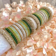 Large stack of antique gold bangles with pretty green ombre shade bangles, finished with sprinkles of crystals and pearls.  Ready to Ship Silk Thread Bangles Design, Bridal Jewellery Inspiration