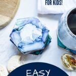 an easy sewing project for kids includes buttons, fabric, and other crafting supplies