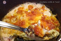 a close up of food in a pot with a spoon