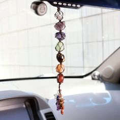 This 7 Chakra Healing Car/Wall Charm is the perfect accessory for your car or home. This beautiful hanging charm has the crystals of the seven chakras, it will bring balance and peace to your environment. A true must-have for any spiritual home or vehicle. Perfect for gift giving too! 1. Root Chakra (Base of Spine): Stone: Red Jasper Properties: Grounding, stability, security, physical health, overcoming fear and anger. 2. Sacral Chakra (Lower Abdomen): Stone: Carnelian Properties: Creativity, p Chakra Heilung, Hippie Car, Stone Decoration, Chakra Pendant, Chakra Healing Crystals, Cute Car Accessories, 7 Chakra, 7 Chakras, Red Agate