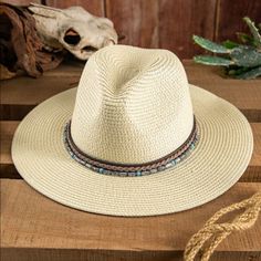 Large Brim Panama Straw Hat With Beautiful Beading. Summer Beach Hat Bands, Adjustable Beach Fedora One Size, Adjustable One Size Fedora For Beach, Adjustable Beach Fedora, Casual Beaded Hat Bands For Festivals, Casual Beaded Hats For Spring, Adjustable Beaded Fedora For The Beach, Casual Beaded Fedora Sun Hat, Summer Vacation Beaded Hat Bands