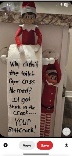 an elf is holding a sign that says why didn't the toilet paper rolls