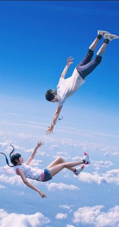 two people are in the air with their feet up