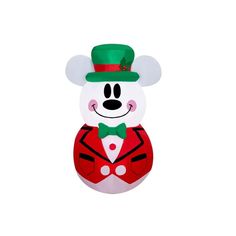 a white teddy bear with a green hat and bow tie wearing a tuxedo