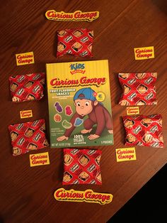 various candy bars are laid out on a table with the packaging in front of them