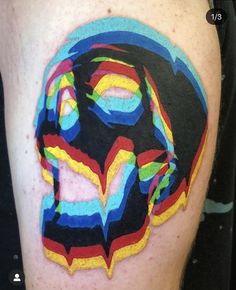 a man's thigh with colorful art work on it