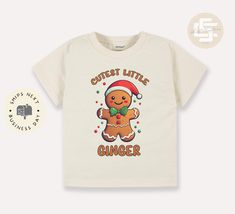 Cutest little ginger Toddler TShirt, Christmas kids shirt, Gingerbread man natural toddler Tee. Looking for a shirt that will show your love for Christmas? Look no further than this Cutest little ginger toddler shirt! This shirt is perfect for any fan of the sport, and it features a cute football graphic on the front. It's also made from a soft and comfortable cotton blend, so you can be sure your little one will be comfortable wearing it all day long. Production time & Shipping Made to order, just for you! Production time is same or next day. We ship all orders next business day. Processing time is 1 to 2 days in the US. Tested and Certified inks. Innobella Textile inks are safe for all ages, Environmentally Friendly Innobella Textile insk are water-based pigment inks and are certified EC Christmas Shirts For Kids, Christmas Look, Christmas Kids, Toddler Tees, Gingerbread Man, Kids Christmas, Kids Shirts, Little One, Environmentally Friendly