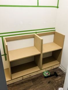 the shelves are being installed in the corner of the room