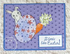 a handmade easter card with a bunny holding a carrot and the words it looks like easter