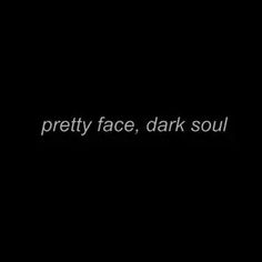 the words pretty face, dark soul written in white on a black background with an image of