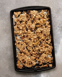 a pan filled with granola on top of a table