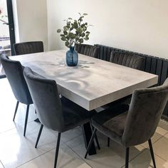 a dining room table with chairs around it