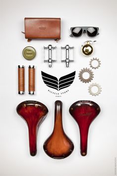 an assortment of items are arranged in the shape of a motorcycle helmet, sunglasses and other accessories