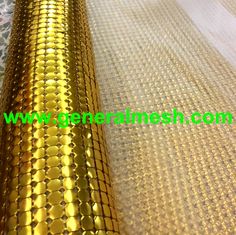 an image of gold mesh fabric on the ground