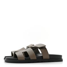 This is an authentic pair ofHERMES Epsom Womens Chypre Sandals size 40 in Etoupe. These stylish sandals are crafted of leather in gray. They feature a toe strap across-over large Hermes H and an adjustable strap. Stylish Sandals, Adjustable Straps, Sandals, Leather