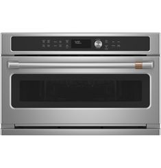 a stainless steel oven with the door open and its electronic controls on it's side