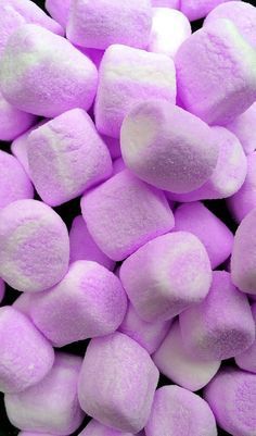 a pile of purple and white marshmallows