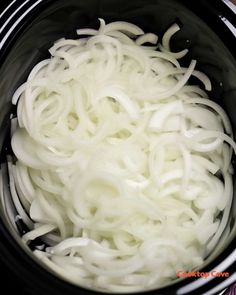 the onions are being cooked in the crock pot for soup or stew, and it is ready to be eaten