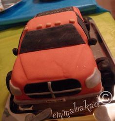 a cake shaped like a car on top of a table