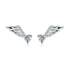 Introducing the Angel Wings Stud Earrings from the Ginger Lyne Collection, a heavenly addition to any jewelry box. These classy earrings for women feature solitaire heart-cut clear 4mm cubic zirconia, cradled in angelic wings. The AAAA quality cubic zirconia sparkles like a celestial star, capturing the essence of purity and love. Each piece is meticulously crafted from .925 genuine fine sterling silver, ensuring durability and a lasting shine. The addition of rhodium plating gives these earring Pandora Angel Wings Earrings, Angel Wing Stud Earrings, Classy Earrings, Heart With Wings, Earrings Heart, Stud Earrings For Women, Butterfly Earrings, Angel Wings, Earrings For Women