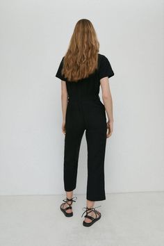 A utility-style jumpsuit perfect for exploring. Detailed with a pointed collar, front buttons and practical side pockets. Style Jumpsuit, Colorful Jumpsuit, Utility Style, Boiler Suit, Bedding Essentials, Linen Dresses, Fashion Face, Quick Delivery, Denim Shop