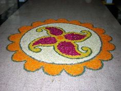 an image of a flower design on the ground