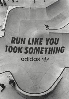 an advertisement for adidas on the side of a skateboard ramp that reads run like you took something