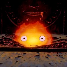 an animated face is shown in front of a fire