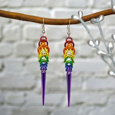 "Show off your pride in style with these rainbow Spike Earrings. 🌈 lightweight - each earring weighs approximately 2.2g (about the weight of a US dime) 🌈 approximately 3.25\" long 🌈 Aluminum links, acrylic spikes and stainless steel earwire RAINBOW colorway: red, orange, gold, green, blue, violet links with a lilac spike If you prefer sterling or hypoallergenic niobium earwire, feel free to request an upgrade here: https://www.etsy.com/listing/1157028577/" Chain Mail Earrings, Pride Earrings, Purple Goth, Lgbtq Rainbow, Pride Flag Colors, Plastic Earrings, Spike Earrings, Rainbow Flag, Frozen 2