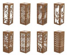 six wooden vases with intricate designs on the front and back sides, each designed to look like filigreens