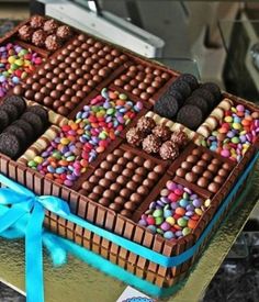 there is a chocolate cake decorated with candy and candies