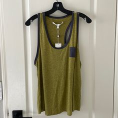 Brand New With Tag. Satin Feel Trim And Front Pocket. Racerback Tank With Stretch. 94% Rayon 6% Spandex. Dry Clean. Green Sporty Tank Top For Everyday, Sporty Green Tank Top, Sporty Green Tank Top For Everyday, Casual Yellow Workout Tank Top, Yellow Racerback Tank Top Casual Style, Casual Yellow Racerback Tank Top, Urban Outfitters Tank Top, Green Sleeveless Blouse, Gray Tank Top