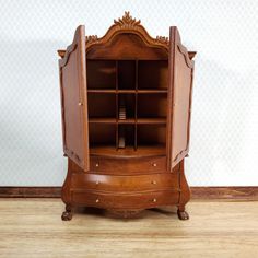 an old fashioned wooden cabinet with drawers