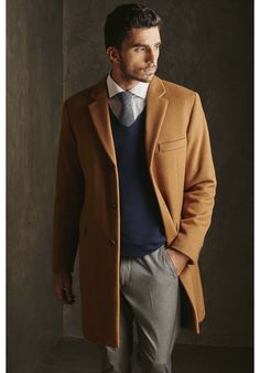 This classic men's top coat is made from 100% Vicuna fiber, the finest, softest and lightest natural fiber in the world. It is extremely soft, yet warm and the ultimate in luxury outerwear. Winter Outerwear With Lapel Collar, Luxury Beige Outerwear For Semi-formal Occasions, Luxury Long Business Sport Coat, Luxury Semi-formal Fall Outerwear, Classic Long Wool Coat For Business, Classic Long Wool Coat For Business Casual, Beige Semi-formal Winter Outerwear, Timeless Long Wool Coat For Business, Luxury Long Coat For Business Casual