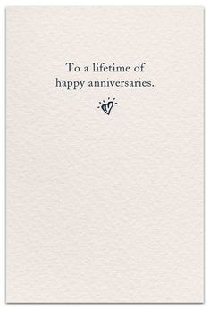 a white card with the words to a life time of happy annivers on it