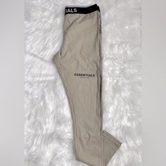 Women’s Leggings Essentials Fear Of God Size: Small Nwt Everyday Fitted Beige Bottoms, Fitted Beige Pants For Streetwear, Fitted Beige Pants For Everyday, Casual Beige Leggings For Loungewear, Essentials Pants, Essentials Fear Of God, Ribbed Leggings, Cotton Leggings, Fear Of God