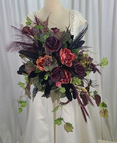 a bridal bouquet is displayed on a mannequin