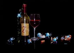 a bottle of wine next to a glass and figurines on a black background