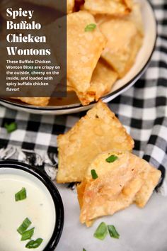 some food is sitting on a plate next to a bowl of ranch dressing and a black and white checkered table cloth