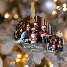 a family ornament hanging from a christmas tree