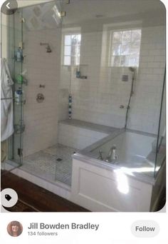 an image of a bathroom setting with white tile and glass shower stall, tub and sink