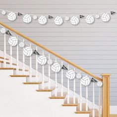 volleyball balls are hanging on the banister