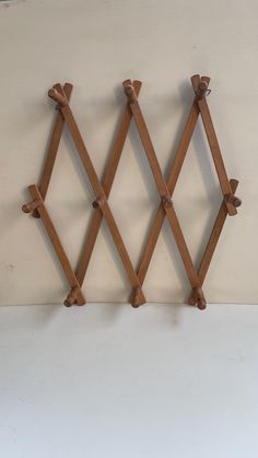 three pieces of wood are hanging on the wall